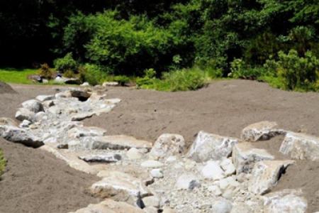 The new swale at Buck Lake Garden Course of rocks for drainage.